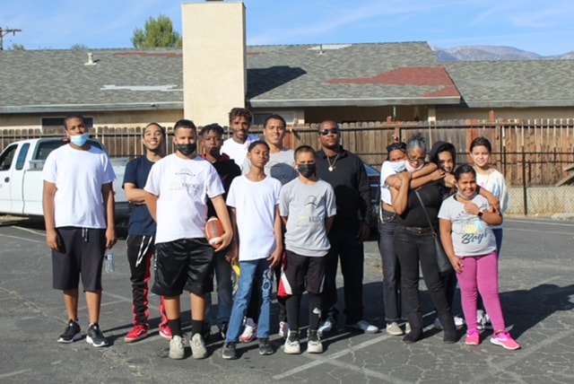 Humanity Against Hunger volunteers gathered at a community food drive