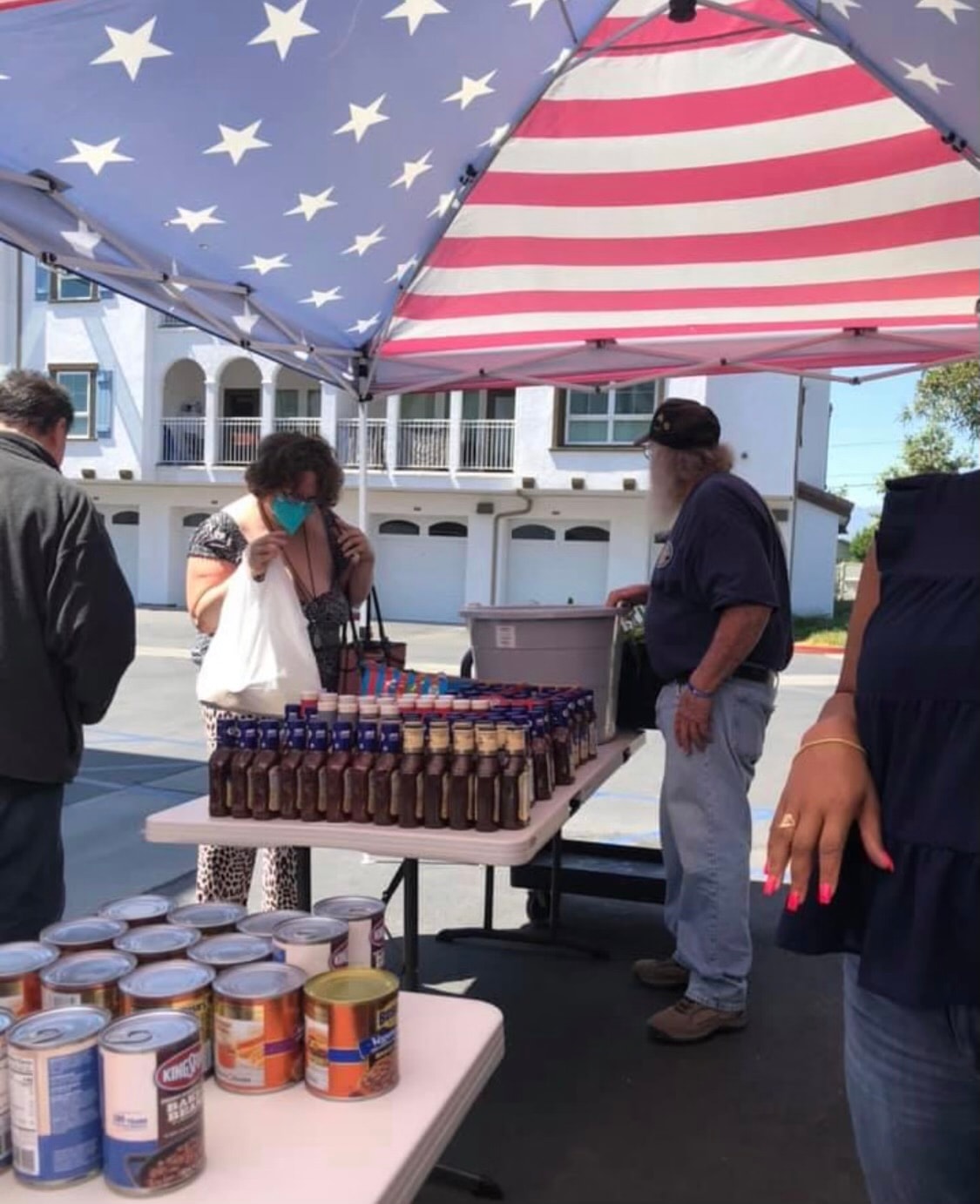 Food drive distribution event with volunteers and recipients